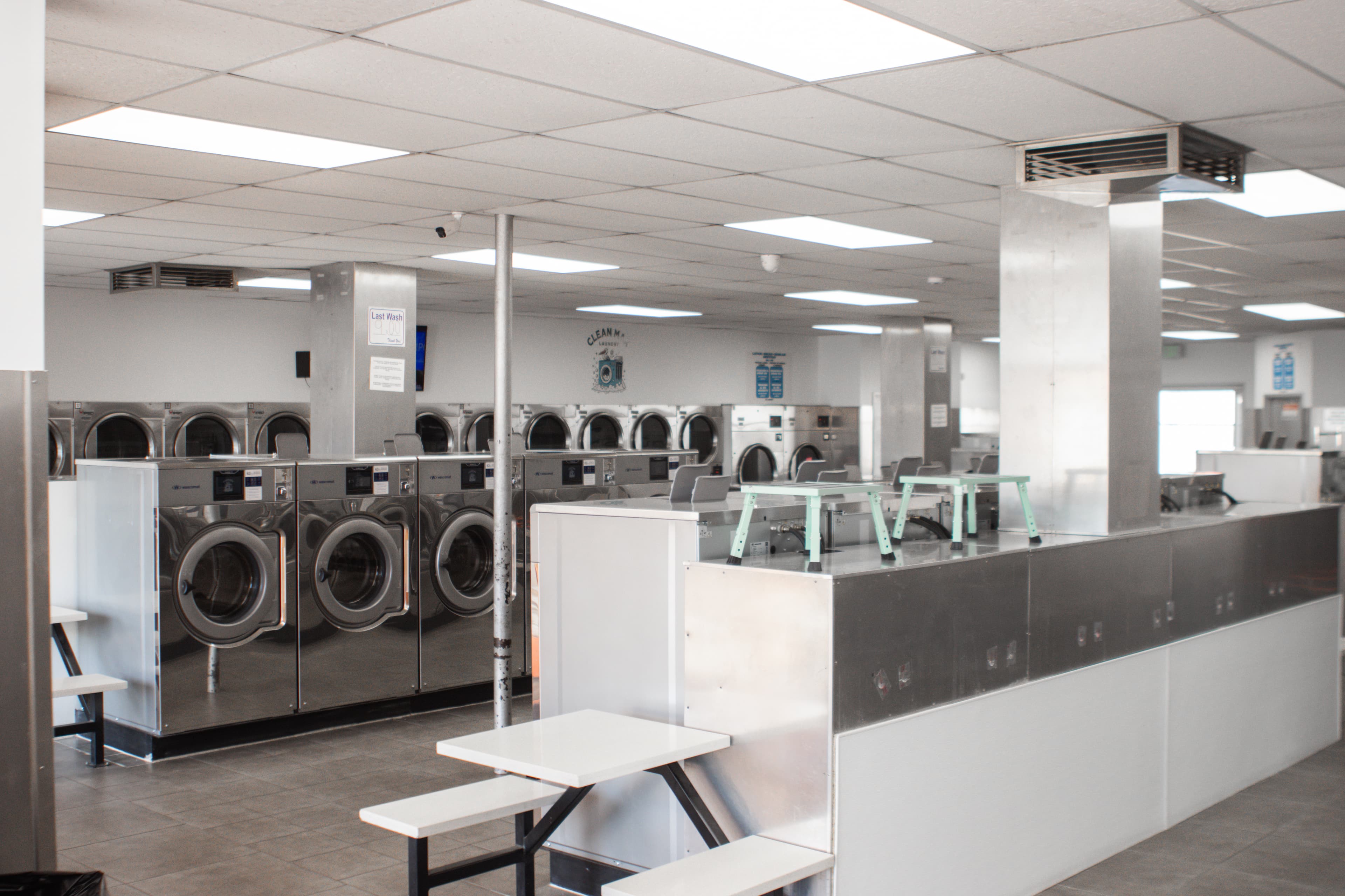 CleanMax Laundry interior — rows of modern machines