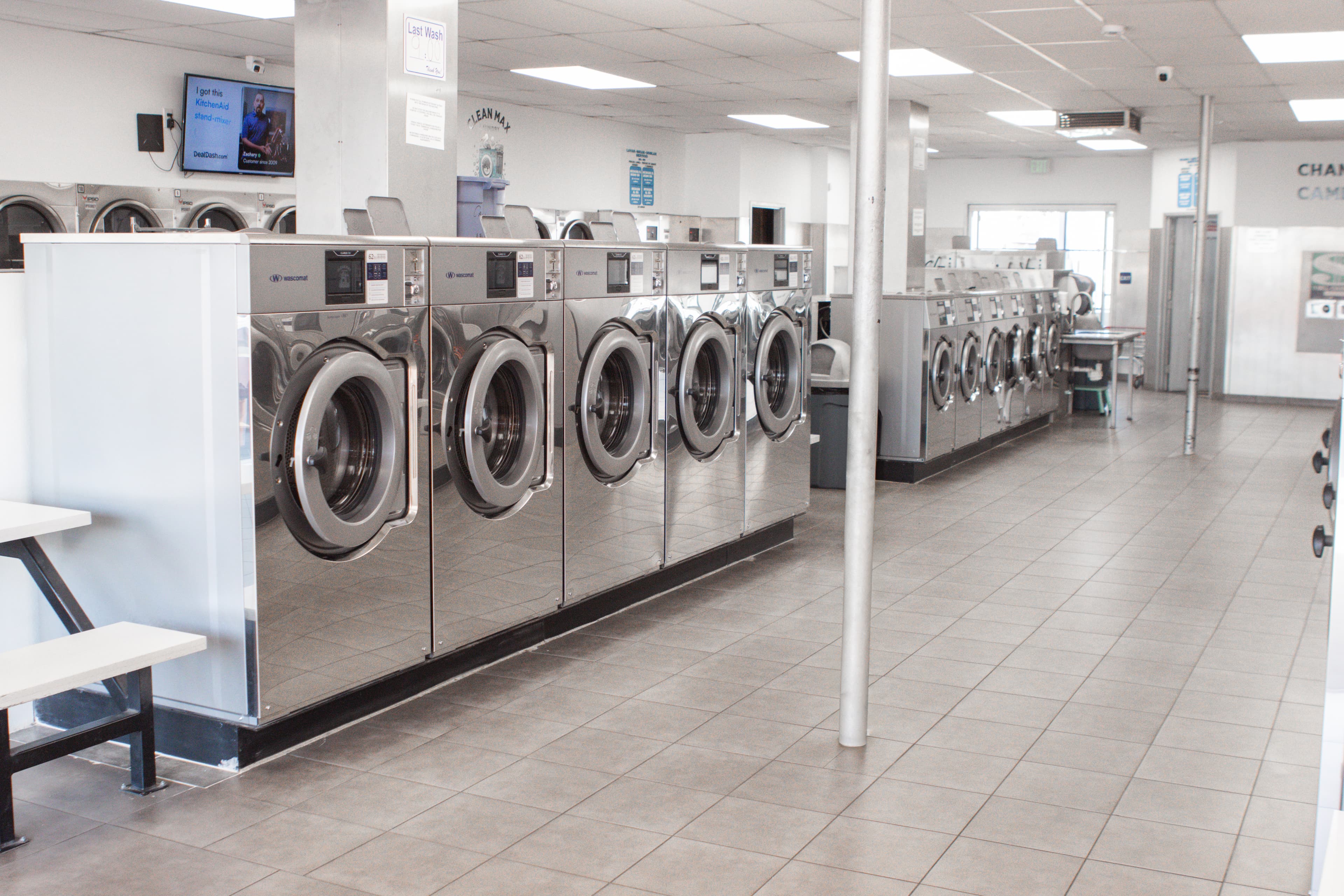 Row of Wascomat washing machines at CleanMax Laundry