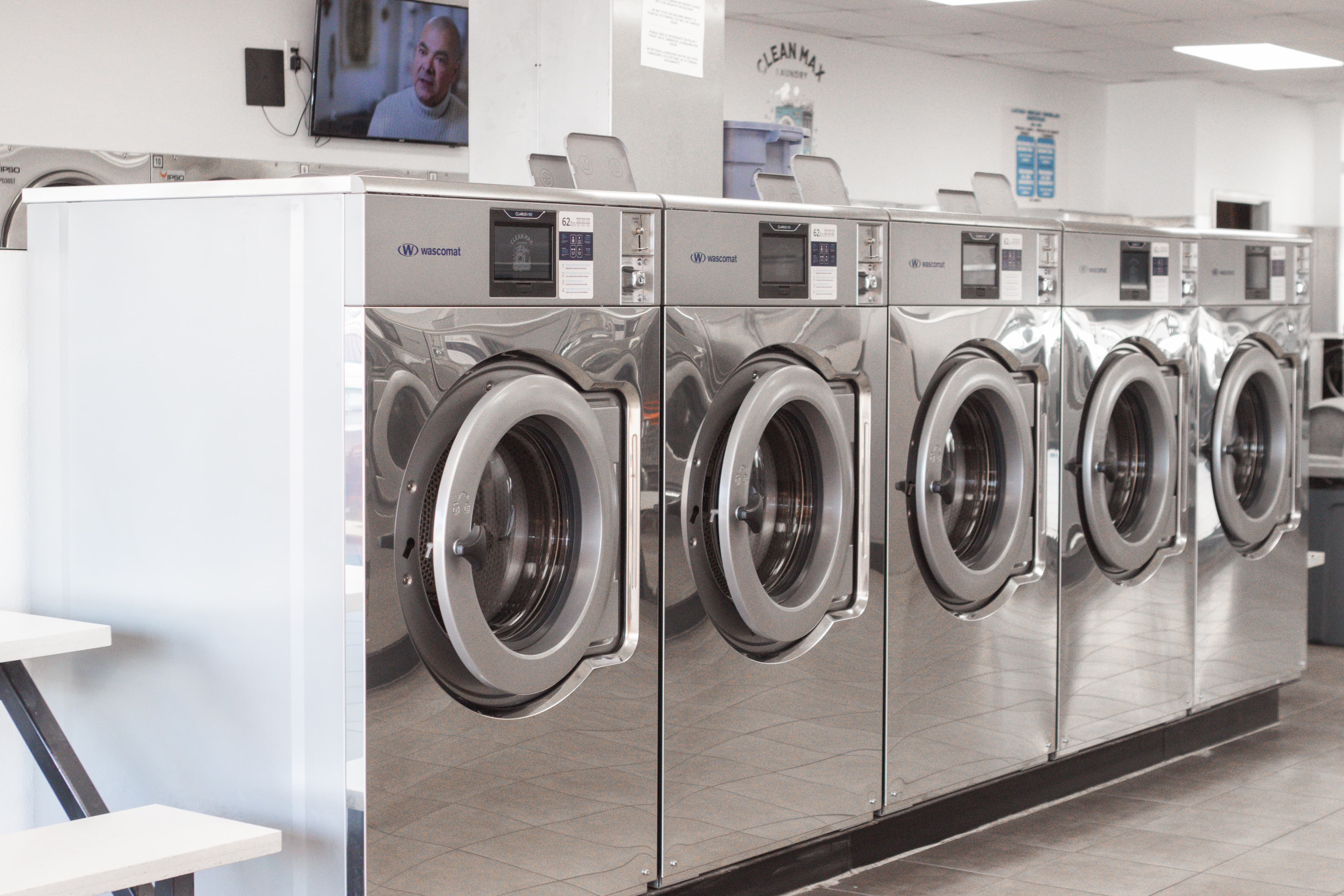 Row of front-load washers at CleanMax Laundry